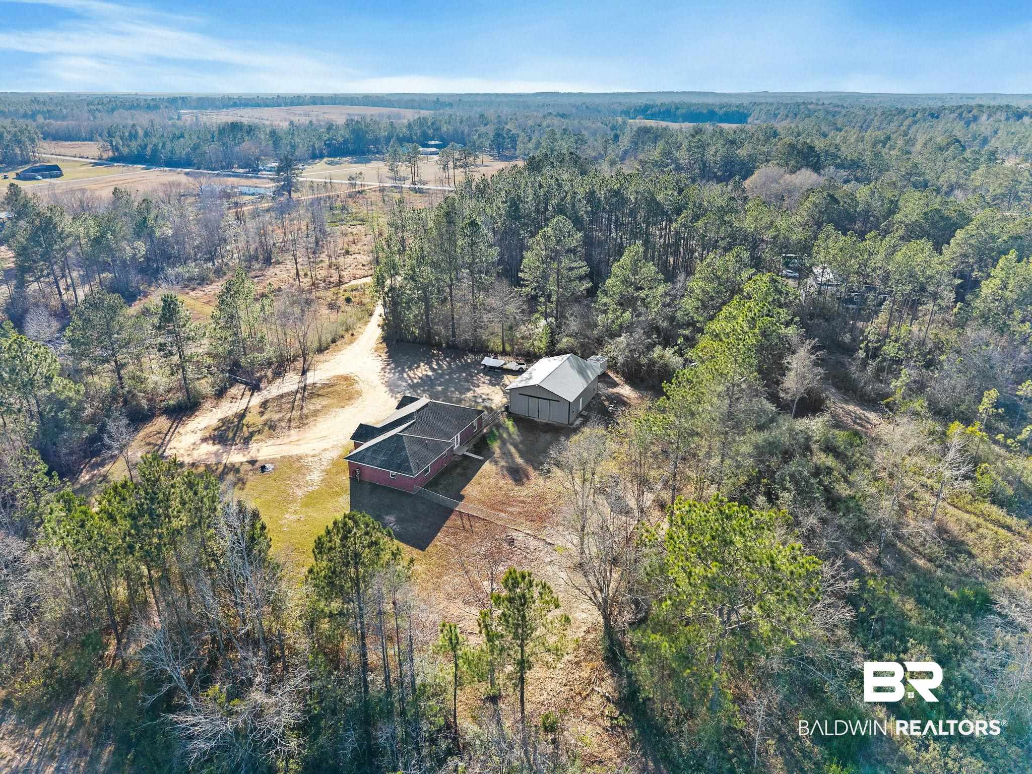 55750 Lottie Road Perdido, AL 36562 - Photo 20 of 84 View of property location featuring a heavily wooded area