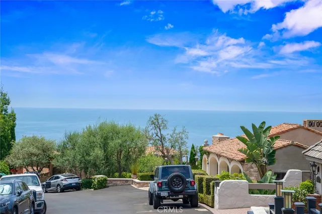 a dining room filled with furniture and large window