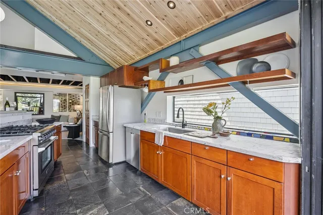 a spacious bedroom with a bed and a couch