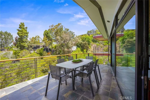 an aerial view of valley and trees