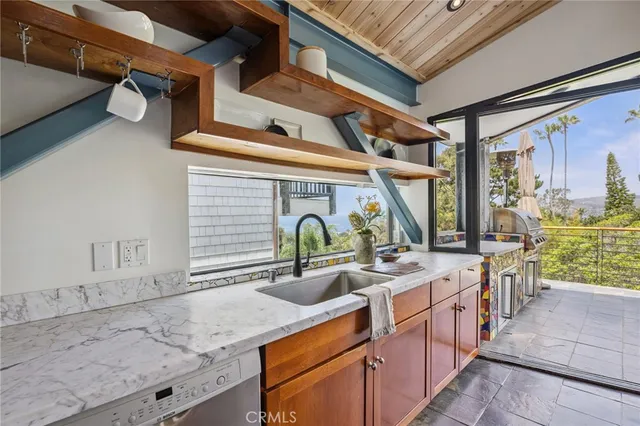 a view of a chairs and table in the balcony