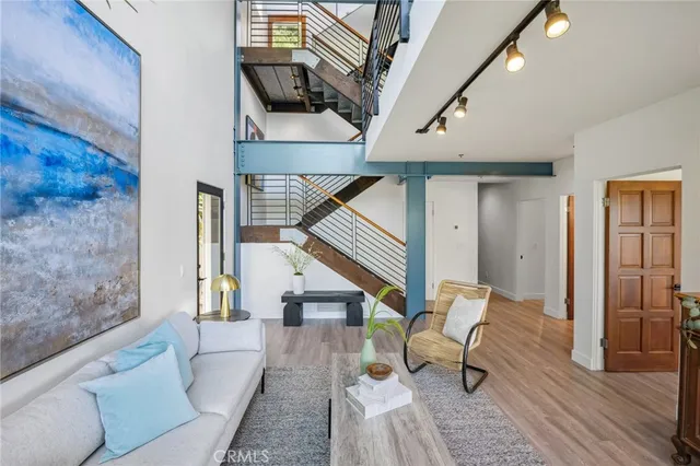 a balcony with furniture and a potted plant