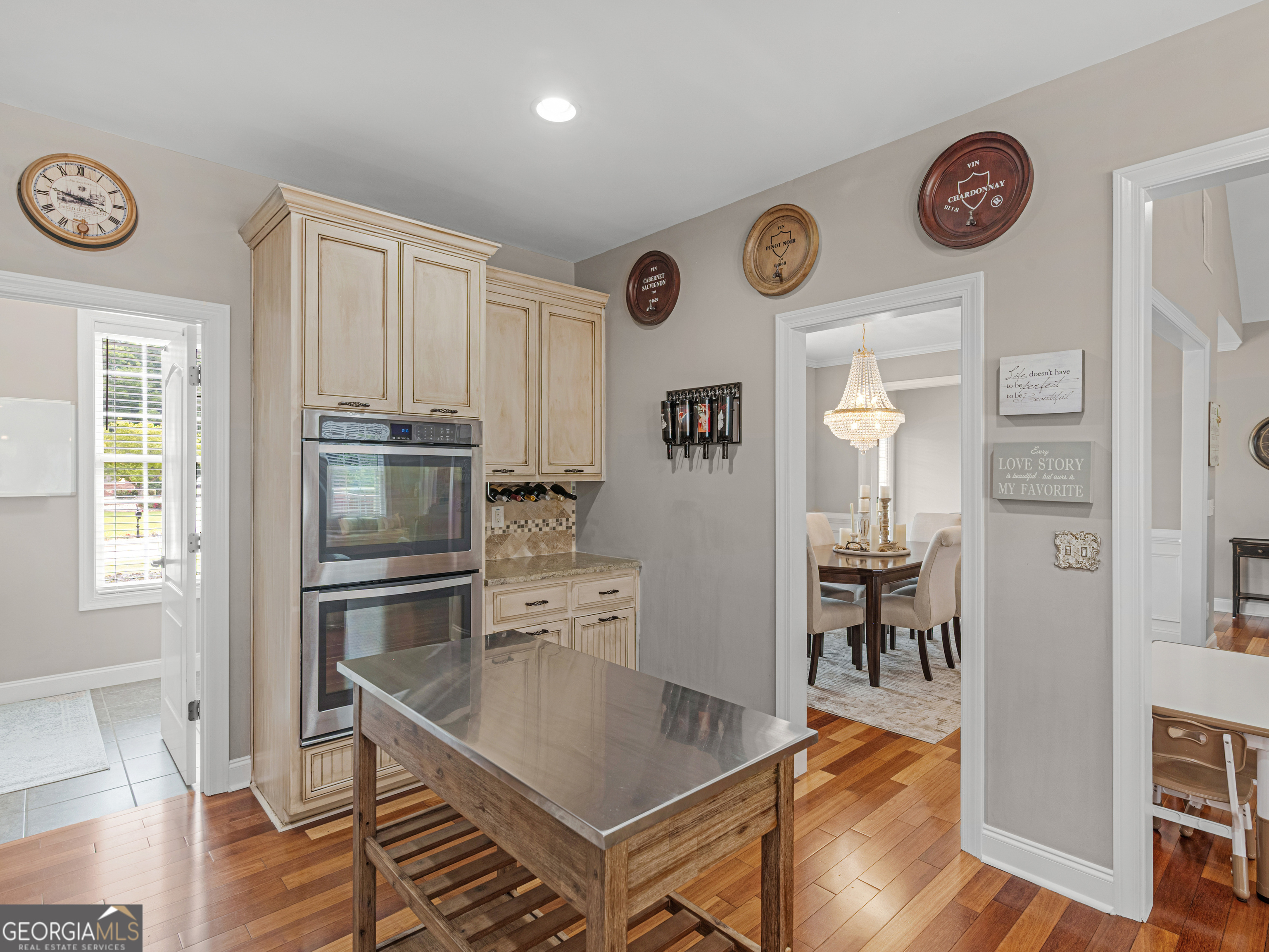 221 Hummingbird Court Hampton, GA 30228 - Photo 25 of 77 a kitchen with stainless steel appliances a refrigerator and a table