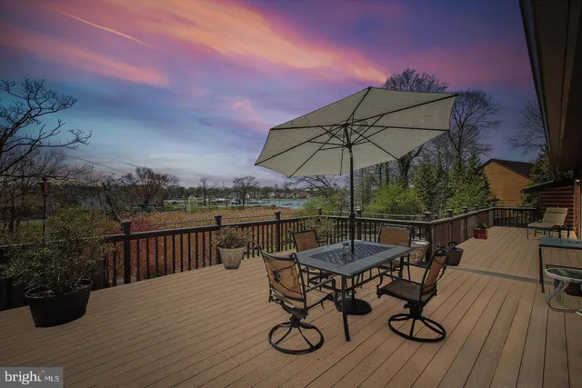a view of a roof deck with furniture