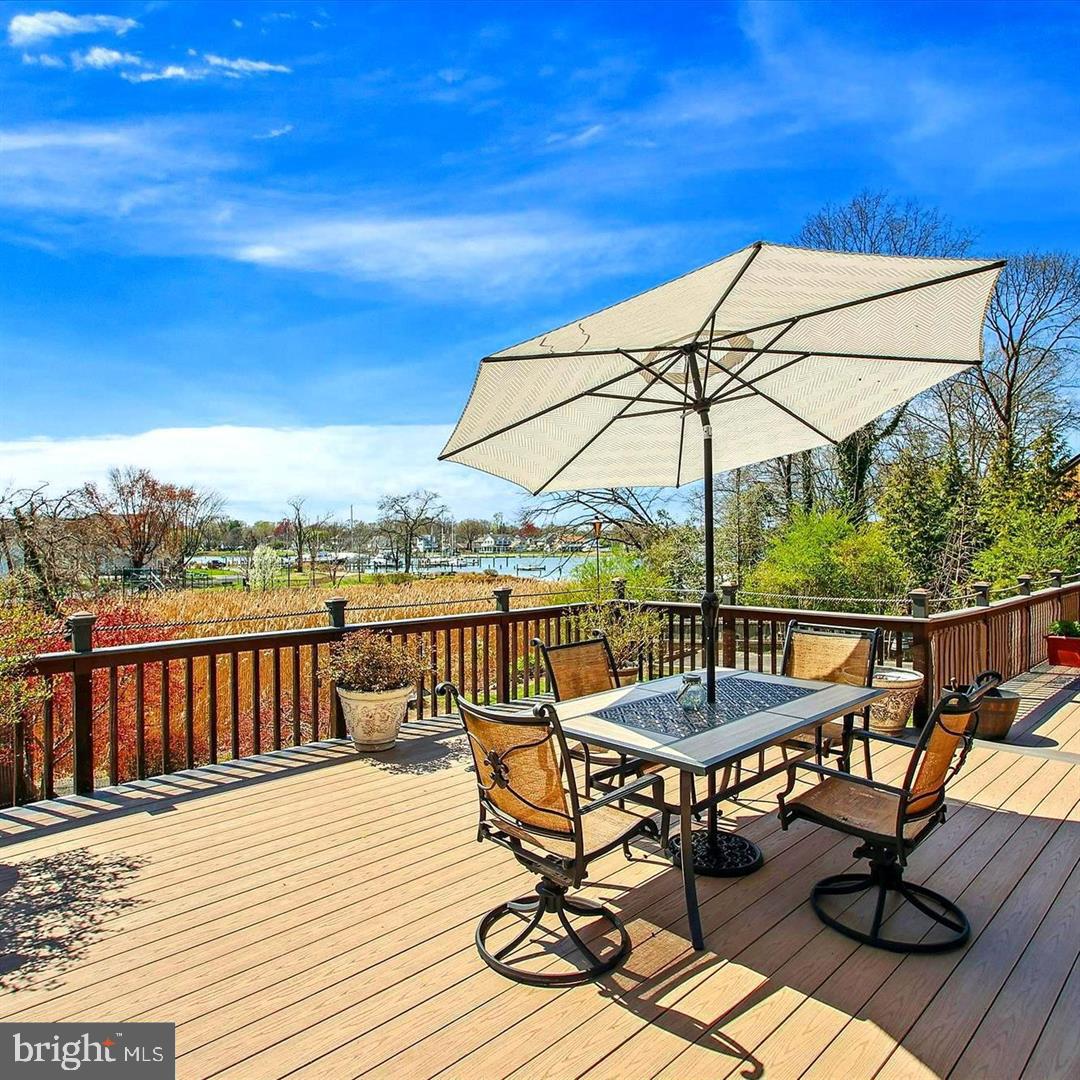 1428 Oak Bluff Road Edgewater, MD 21037 - Photo 12 of 43 a view of a balcony with wooden floor and outdoor seating