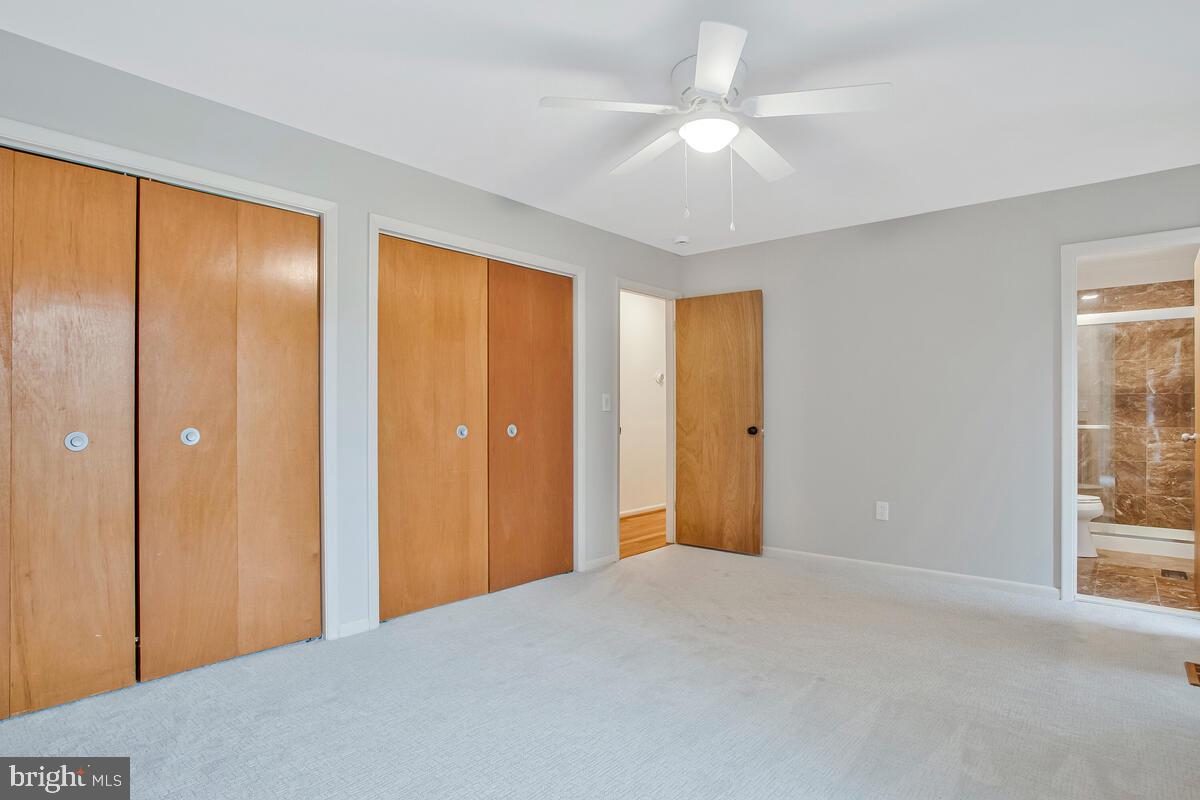 1428 Oak Bluff Road Edgewater, MD 21037 - Photo 20 of 43 a view of a room with a large window and ceiling fan