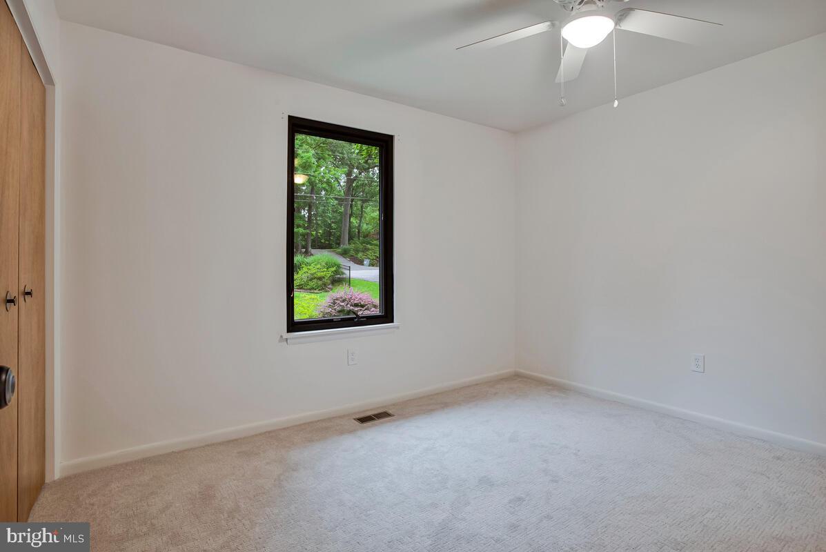 1428 Oak Bluff Road Edgewater, MD 21037 - Photo 22 of 43 an empty room with a window