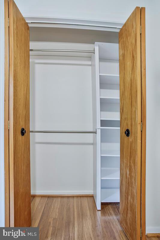 1428 Oak Bluff Road Edgewater, MD 21037 - Photo 26 of 43 a view of walk in closet with empty racks