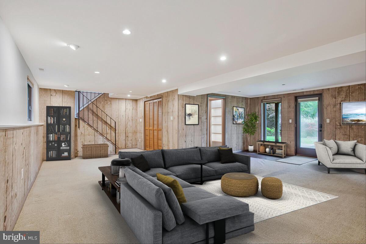 1428 Oak Bluff Road Edgewater, MD 21037 - Photo 28 of 43 a living room with furniture and a wooden floor