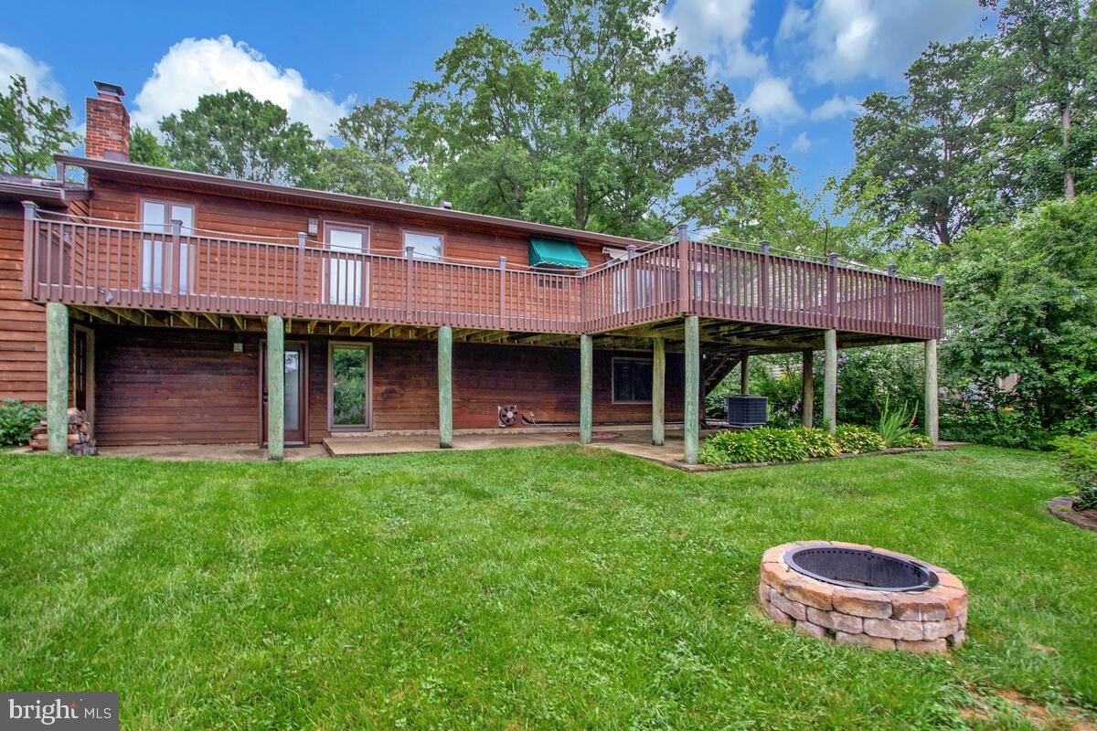 1428 Oak Bluff Road Edgewater, MD 21037 - Photo 38 of 43 a front view of a house with garden