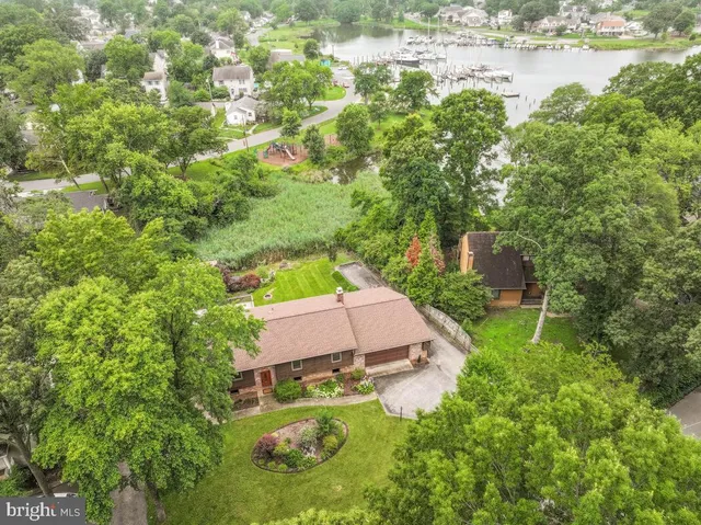 an aerial view of house with yard swimming pool and outdoor seating