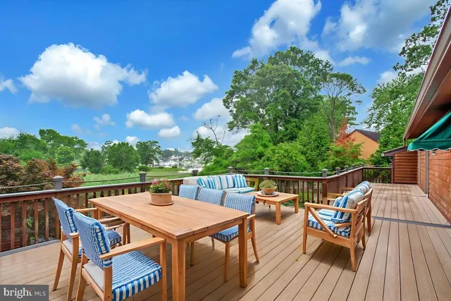 a view of a roof deck with seating area