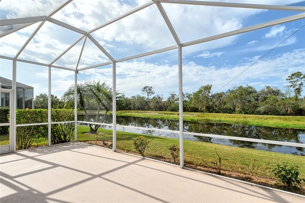 6504 Copper Ridge Trail Bradenton, FL 34201 - Photo 30 of 55 View of screened lanai facing lake and preserve