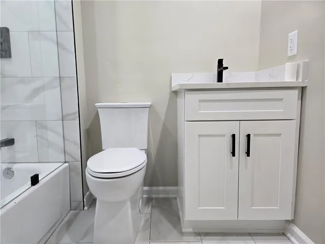 a bathroom with a toilet and a sink