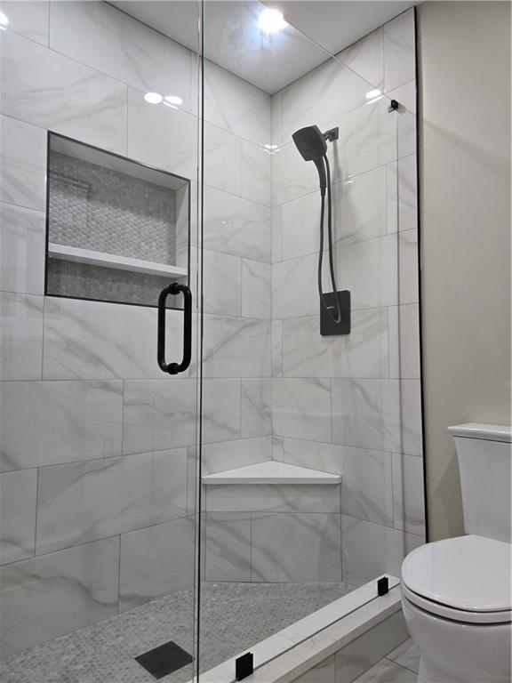 3817 Captain Drive Atlanta, GA 30341 - Photo 15 of 18 a bathroom with a shower and toilet