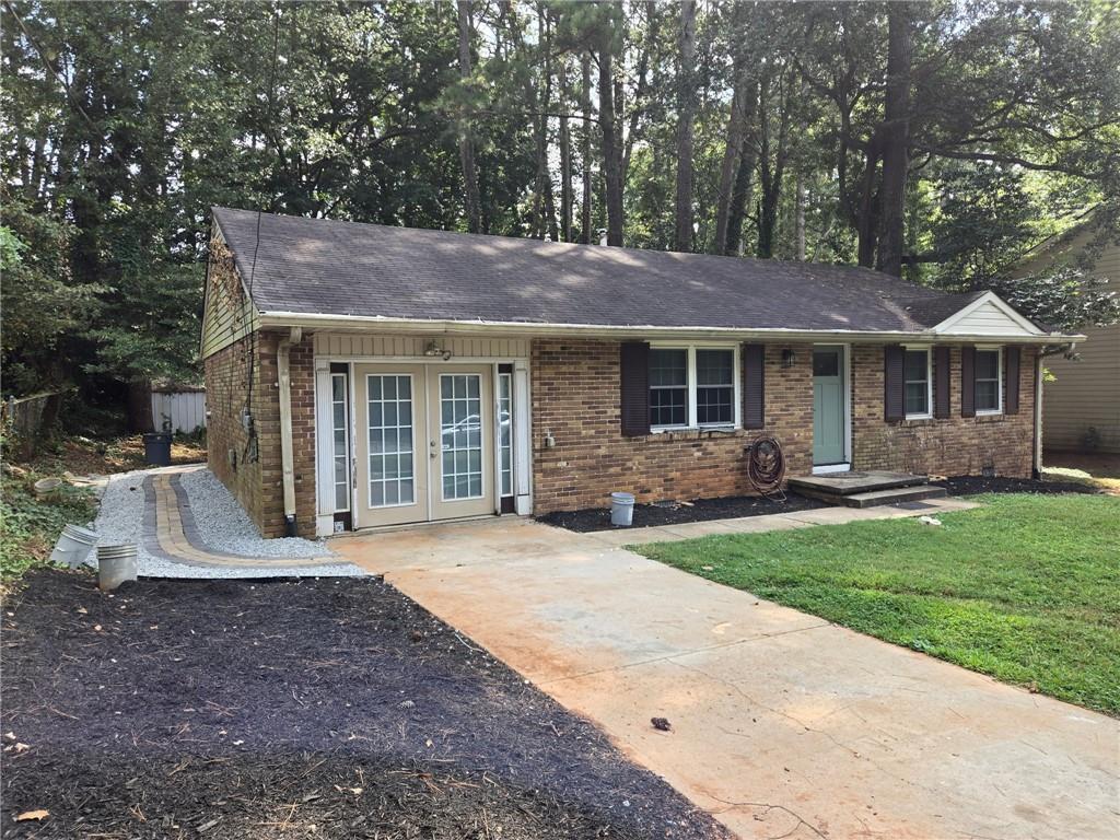 3817 Captain Drive Atlanta, GA 30341 - Photo 18 of 18 a front view of a house with a garden and yard
