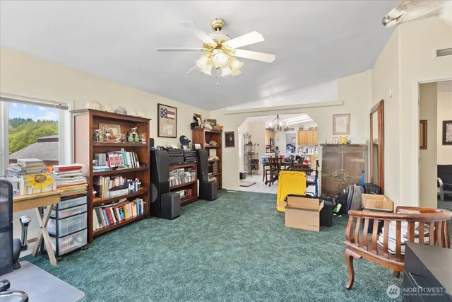 a living room with lots of furniture and a chandelier