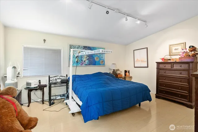 a bedroom with a bed and dresser