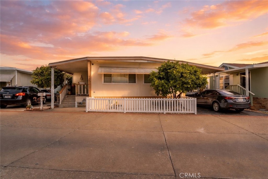a view of a car park in front of house