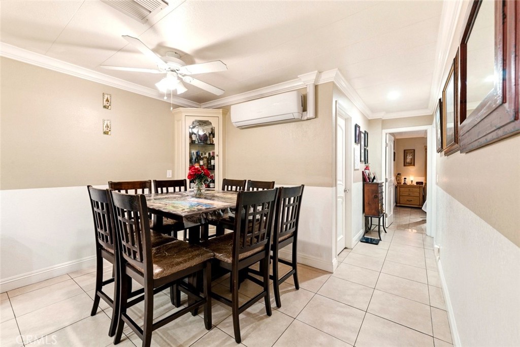 133 Colombo Lane Tustin, CA 92780 - Photo 12 of 26 a view of a dining room with furniture and chandelier