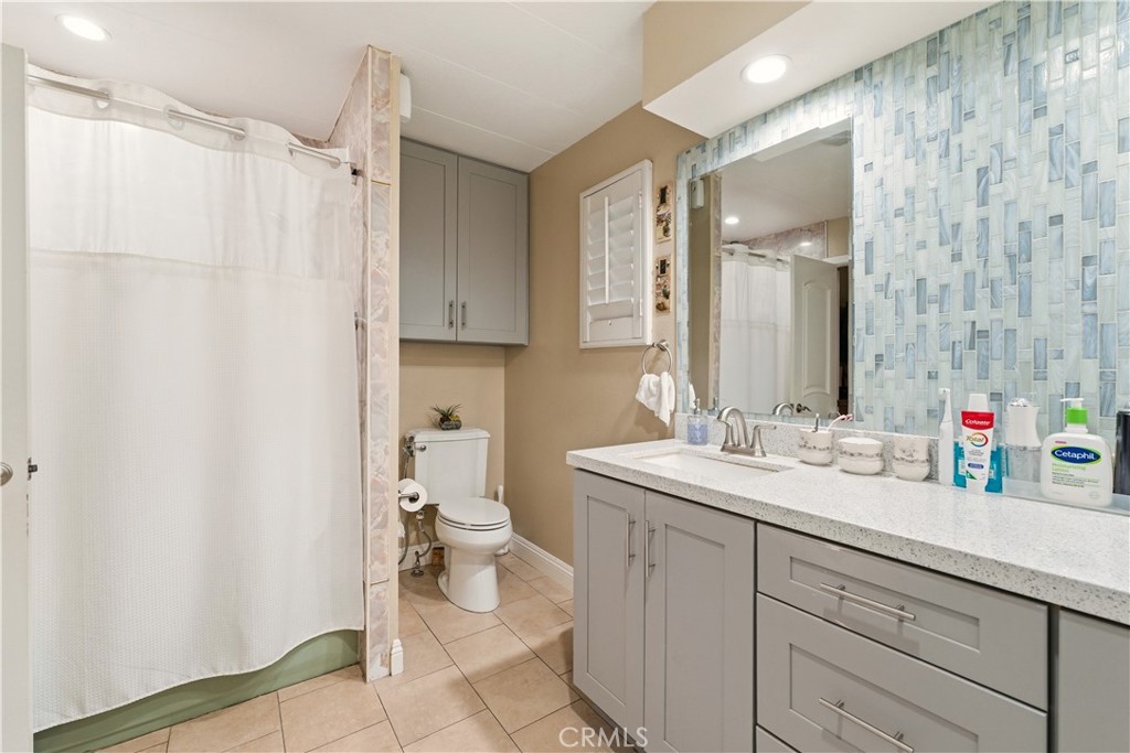 133 Colombo Lane Tustin, CA 92780 - Photo 16 of 26 a bathroom with a sink a toilet and a mirror
