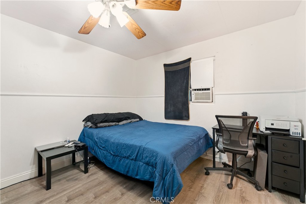 133 Colombo Lane Tustin, CA 92780 - Photo 23 of 26 a bedroom with a bed and a table in it