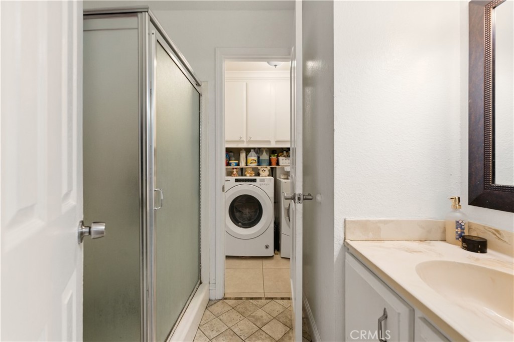 133 Colombo Lane Tustin, CA 92780 - Photo 24 of 26 a bathroom with a sink and a mirror