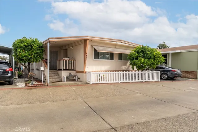 a view of a house with a yard and garage