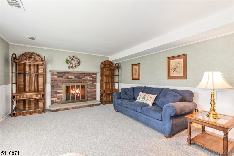 11 Dorr Road New Providence, NJ 07974 - Photo 17 of 28 a living room with furniture and a fireplace