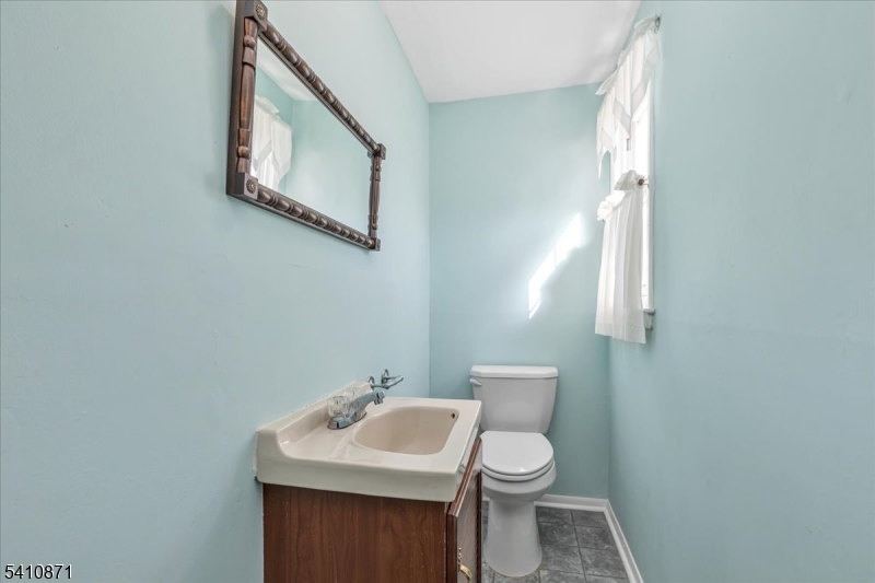 11 Dorr Road New Providence, NJ 07974 - Photo 19 of 28 a bathroom with a toilet sink and mirror