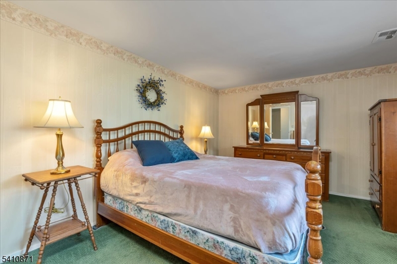 11 Dorr Road New Providence, NJ 07974 - Photo 20 of 28 a bedroom with a bed and a yard