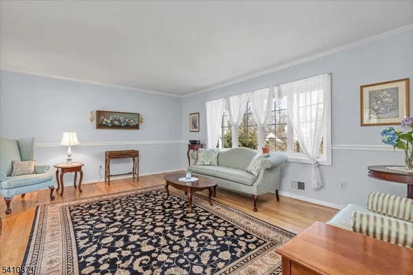 a living room with furniture and a rug