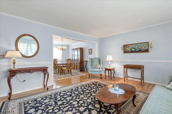 a living room with furniture a fireplace and a table