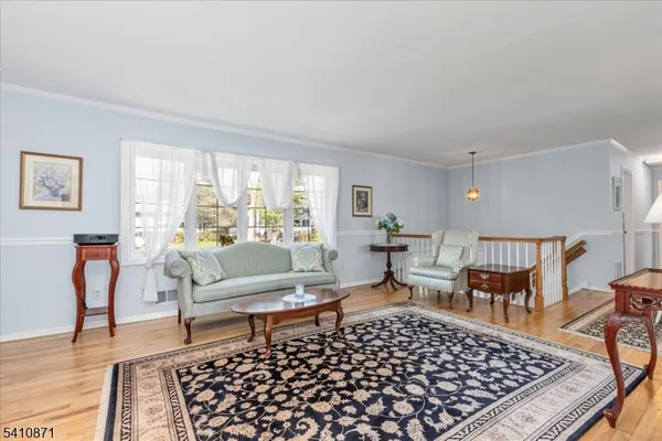 a living room with furniture rug and window