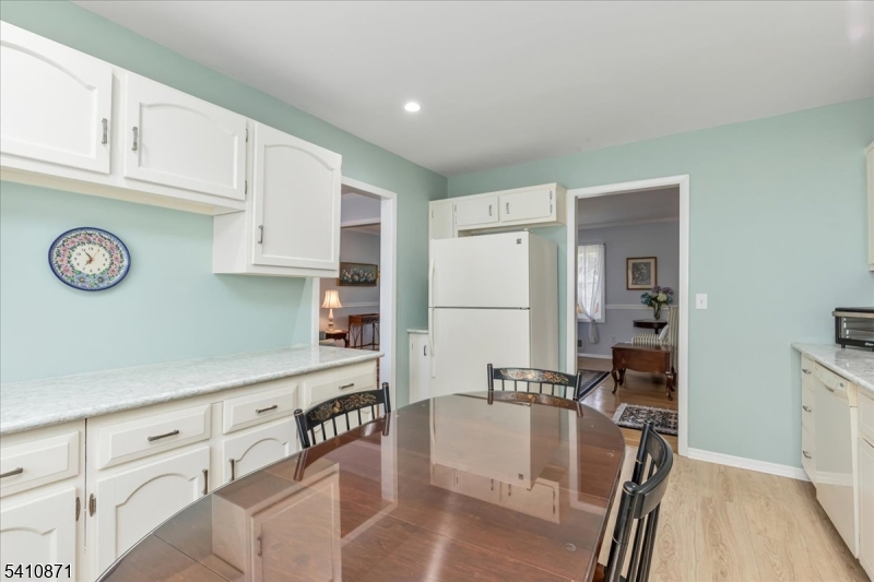 11 Dorr Road New Providence, NJ 07974 - Photo 10 of 28 a kitchen with stainless steel appliances granite countertop a refrigerator and a stove top oven