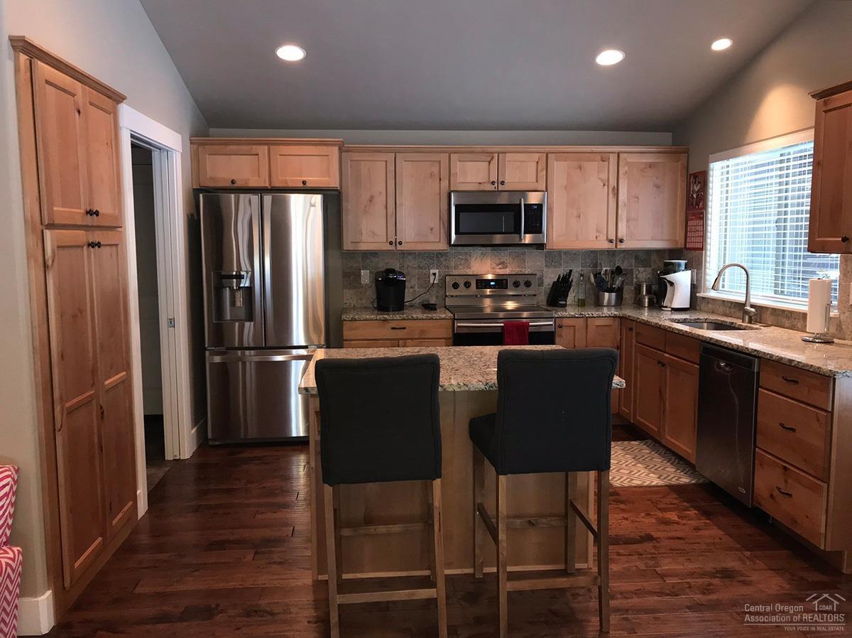16923 Indio Road Bend, OR 97707 - Photo 5 of 24 Generous alder cabinetry in the kitchen.