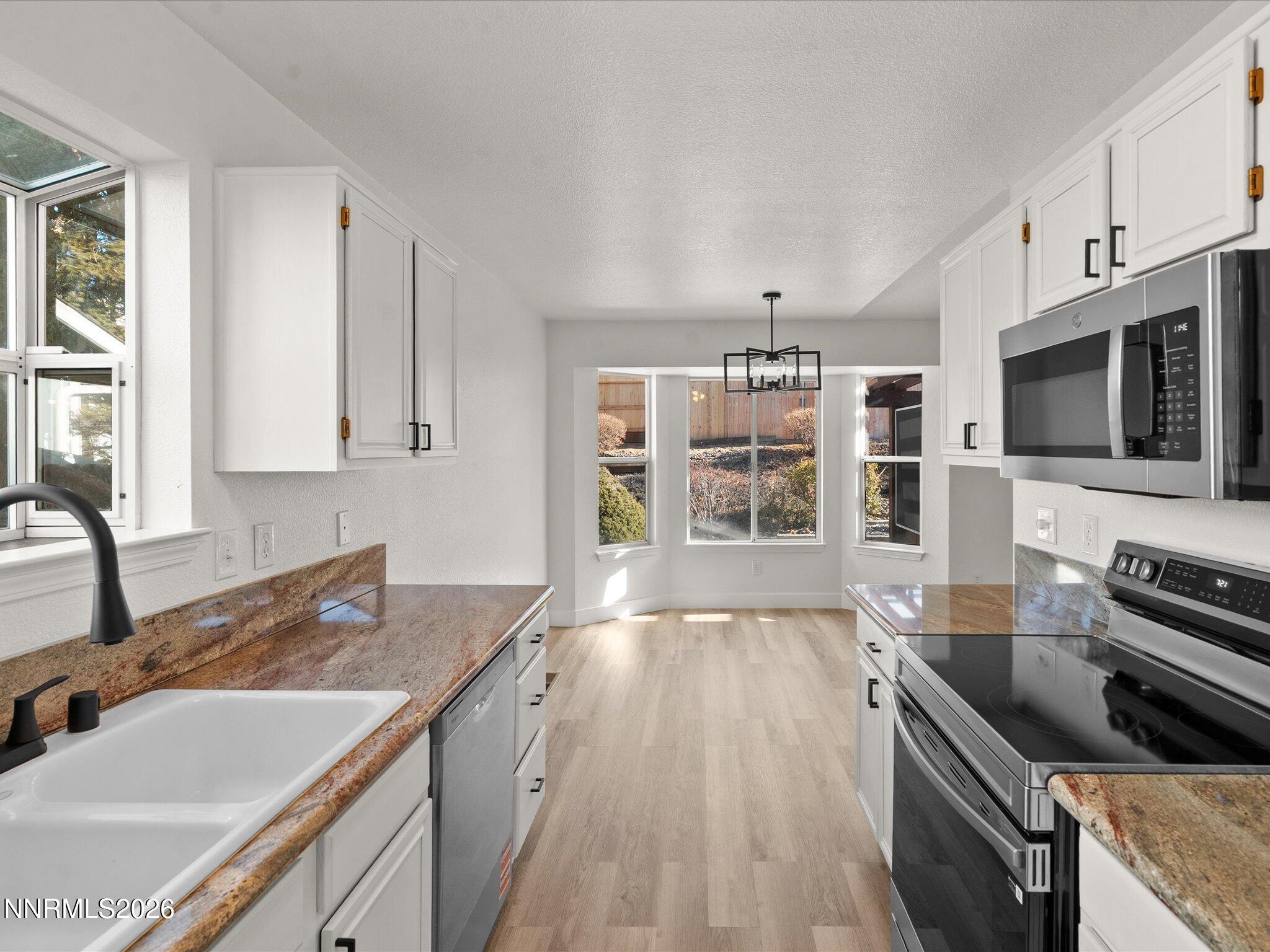 3549 Shadow Lane Carson City, NV 89705 - Photo 11 of 32 a kitchen with a stove and a sink