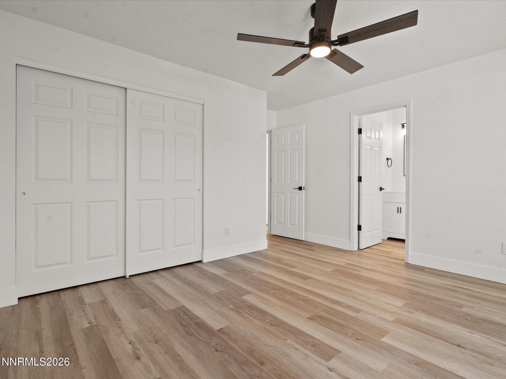 3549 Shadow Lane Carson City, NV 89705 - Photo 14 of 32 a view of an empty room with a ceiling fan