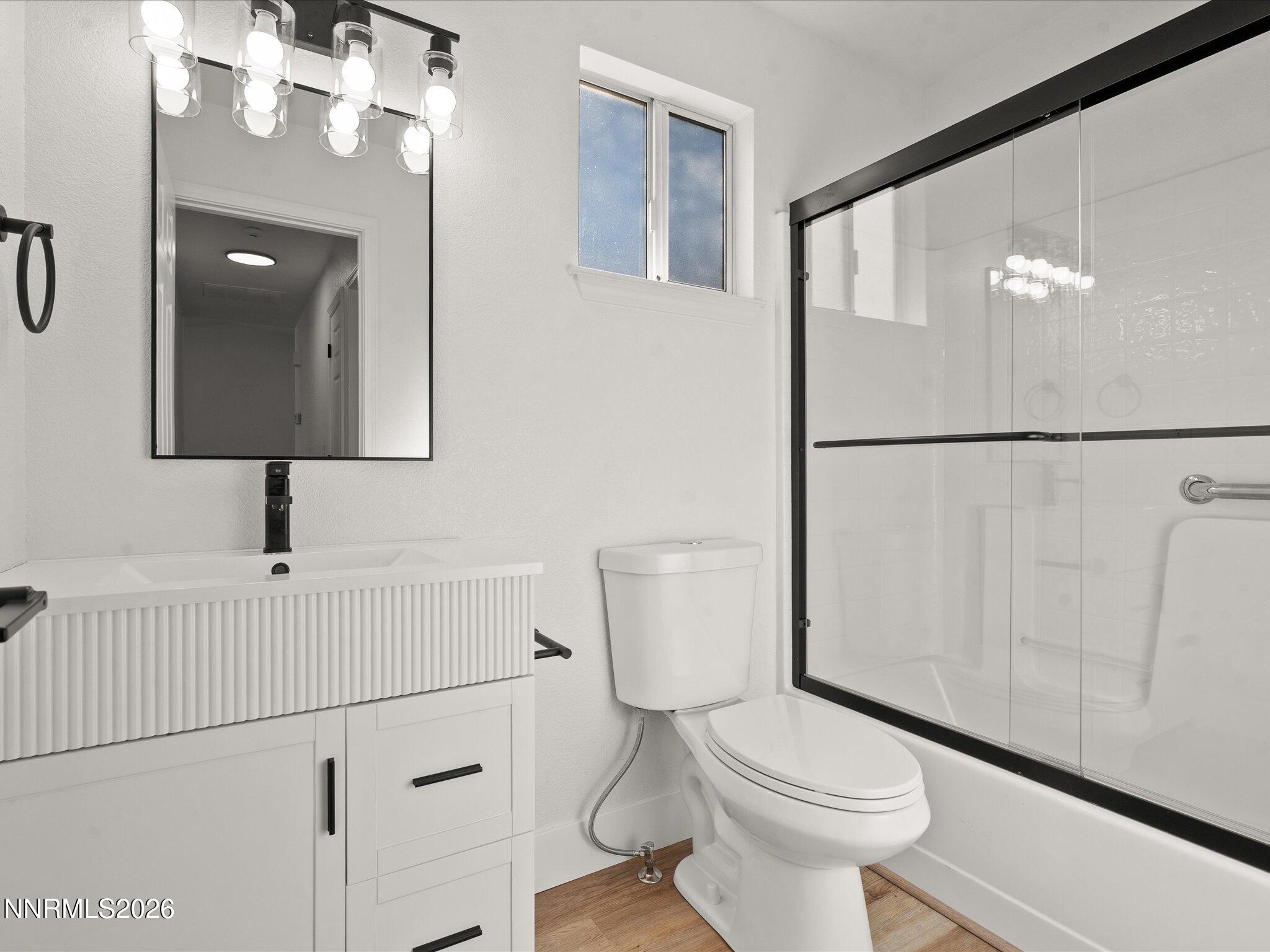 3549 Shadow Lane Carson City, NV 89705 - Photo 19 of 32 a white toilet sitting next to a bathroom sink