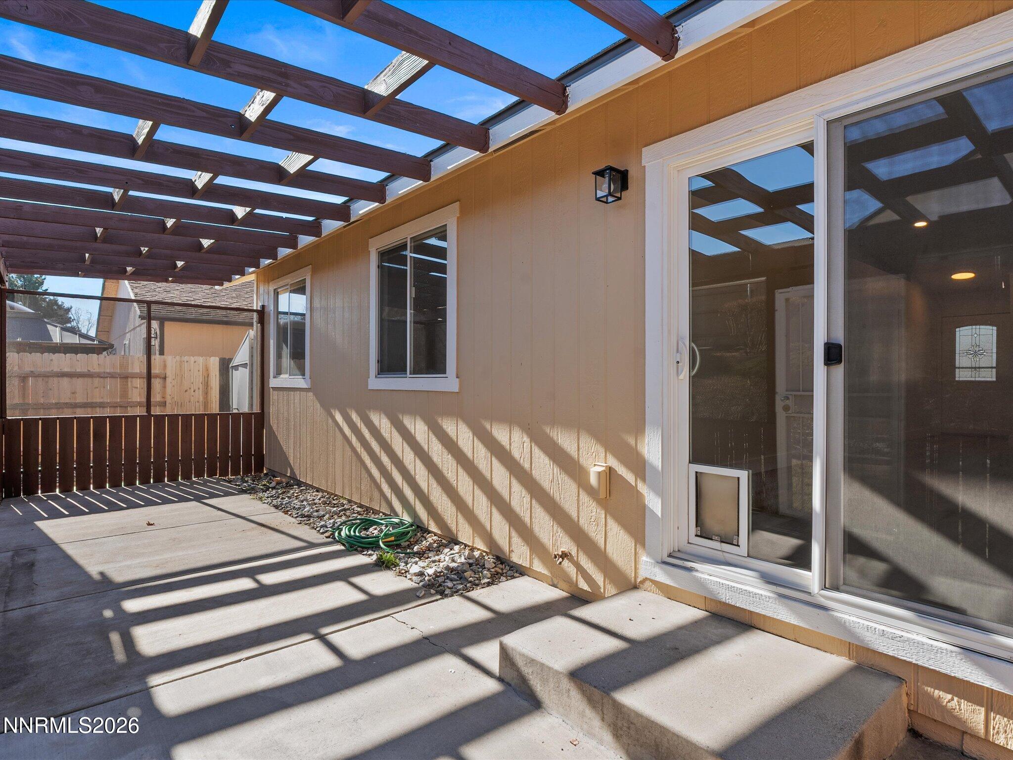 3549 Shadow Lane Carson City, NV 89705 - Photo 25 of 32 a view of a balcony with a table and chairs