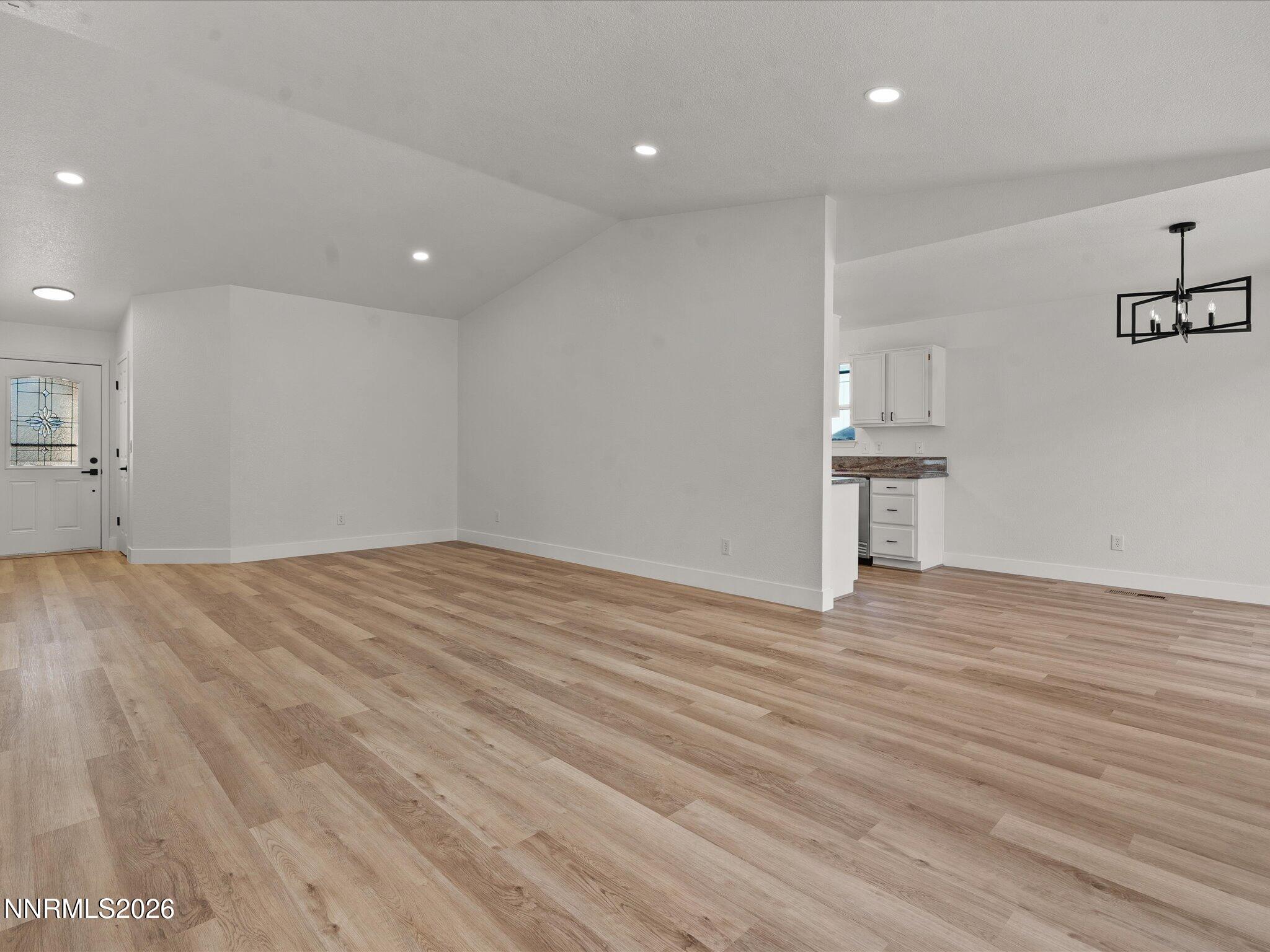 3549 Shadow Lane Carson City, NV 89705 - Photo 6 of 32 a view of empty room with wooden floor