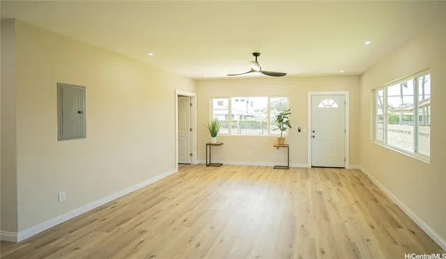 a view of a kitchen with wooden floor and a sink