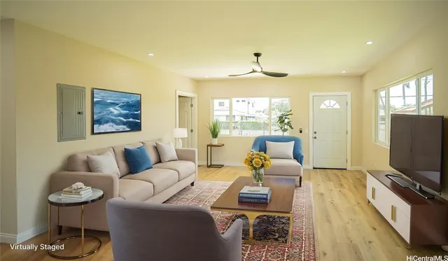 a living room with furniture and a flat screen tv