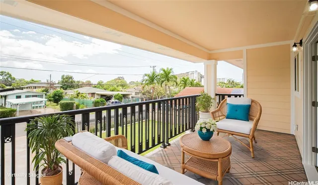 a view of a chair and table in the balcony