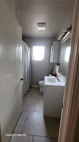 a bathroom with a sink a mirror and a shower