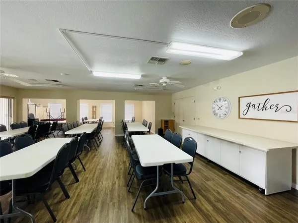 a view of a dining area with furniture and wooden floor