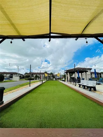 a view of a swimming pool and an outdoor seating