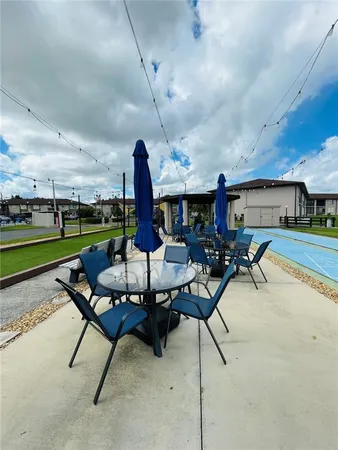 a view of a backyard with sitting area