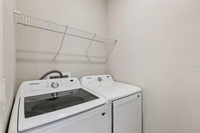 a utility room with dryer and washer