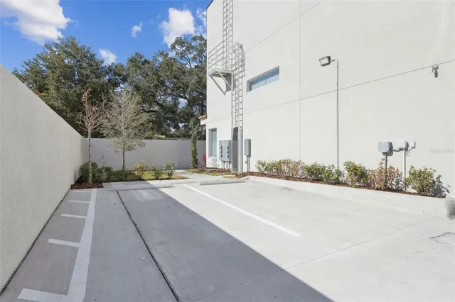 a house with a yard and a large parking space